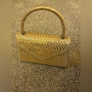 Gold sparkling clutch